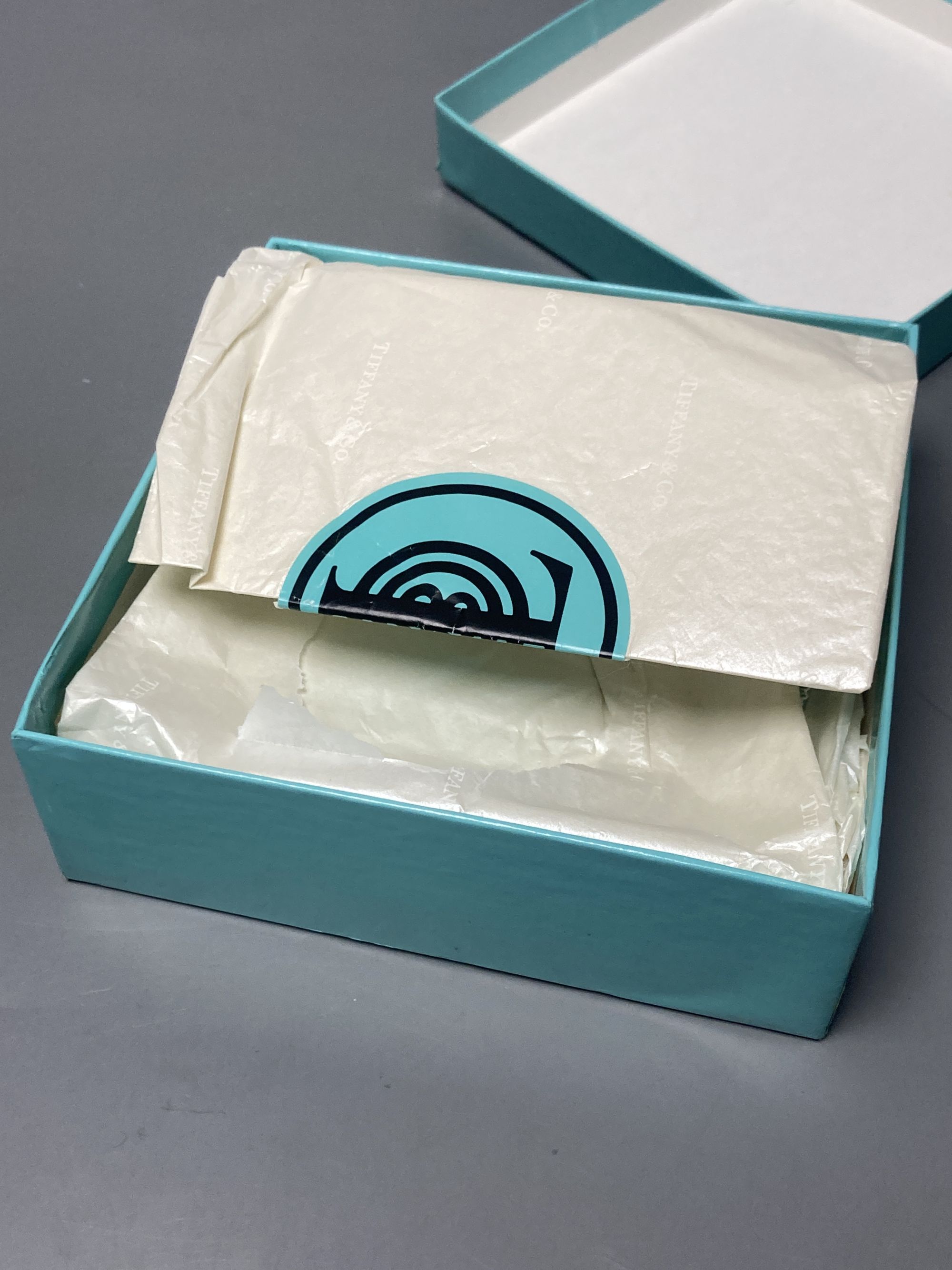 A boxed Tiffany alarm clock, 9 x 8cm